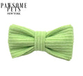 Bean green velcro dog bowtie collar accessory in soft knit fabric, shown on white background with Pawsome Pets New York branding — available in XS/S and M/L sizes
